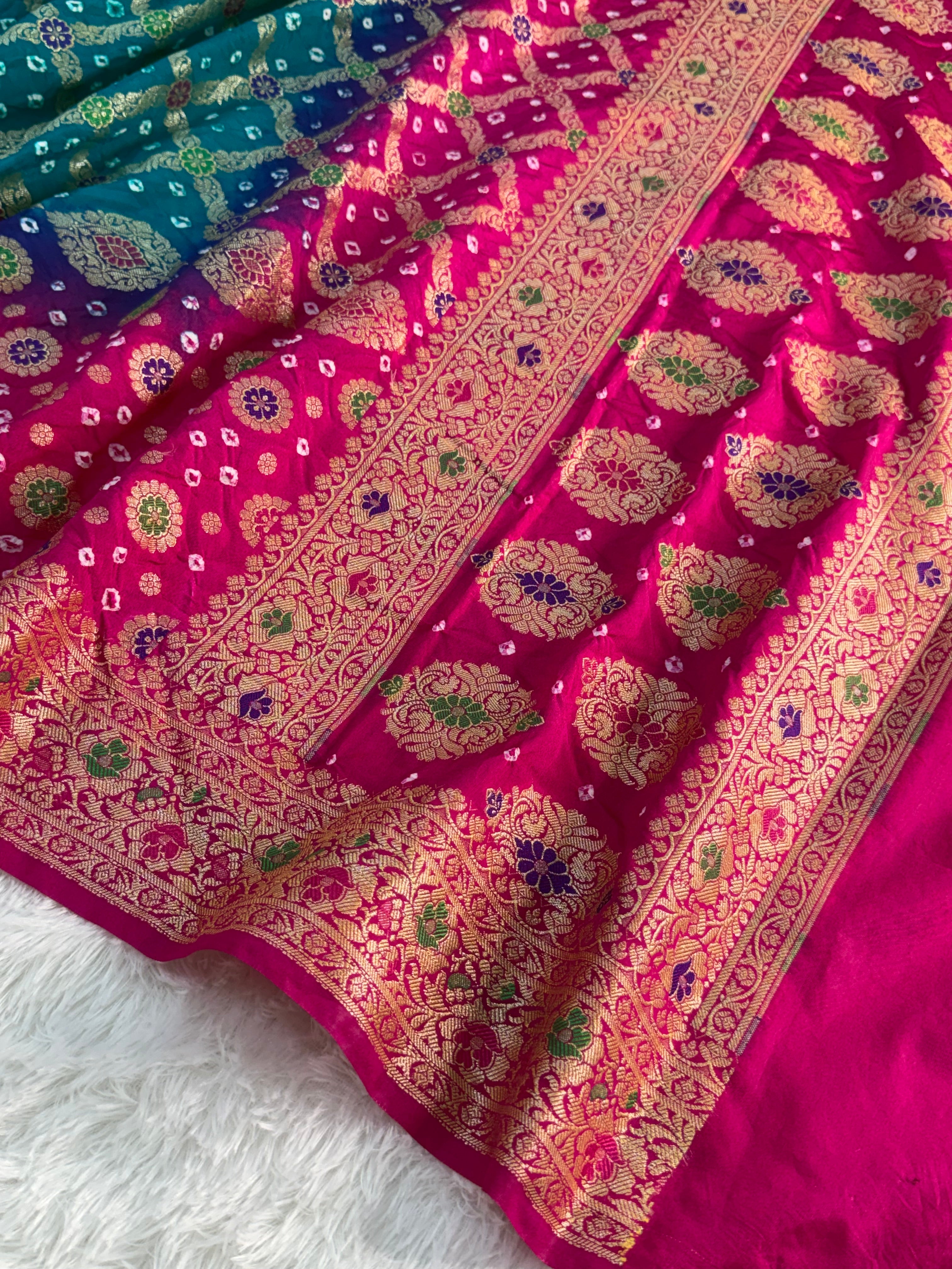 Banarasi Raw Silk Saree with Hand bandej all over in Motifs Design in Rani and Bottle Green Colour