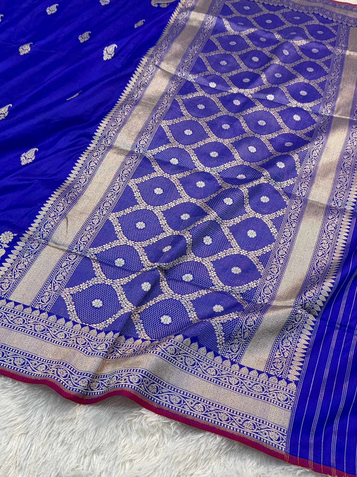 Handwoven pure katan silk saree with interlock weaving motifs in intricate silver and gold zari with Maroon Edge and Konia design in Royal Blue colour