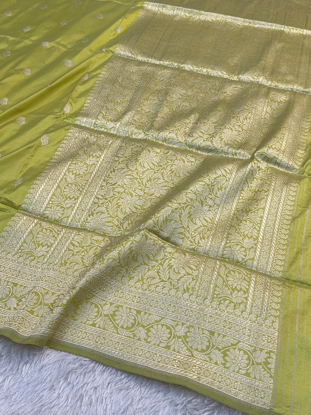 Handwoven pure katan silk saree with interlock weaving motifs with intricate silver zari in Neon Pista colour