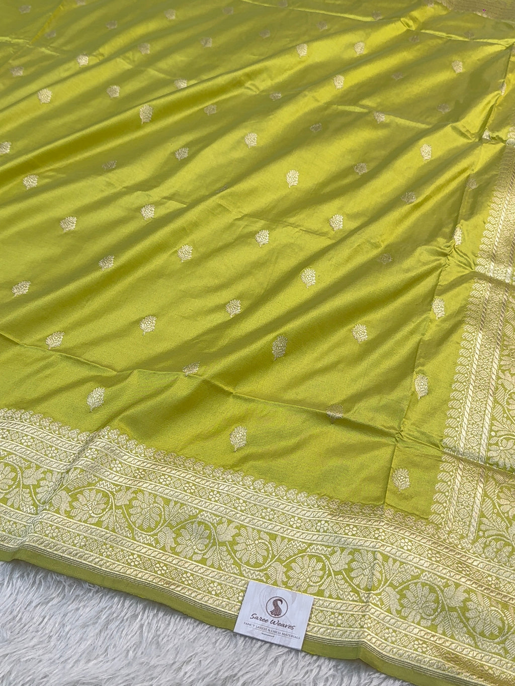 Handwoven pure katan silk saree with interlock weaving motifs with intricate silver zari in Neon Pista colour