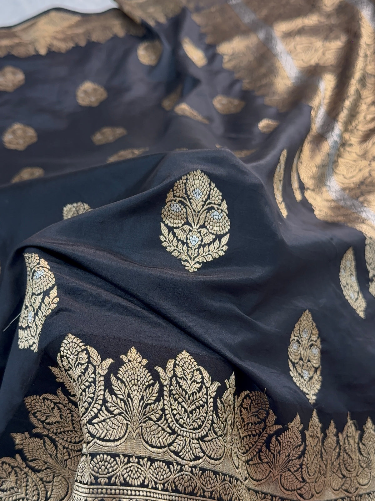 Banarasi Raw Mango Silk Saree with Satin Border and Buta Design In Black Colour