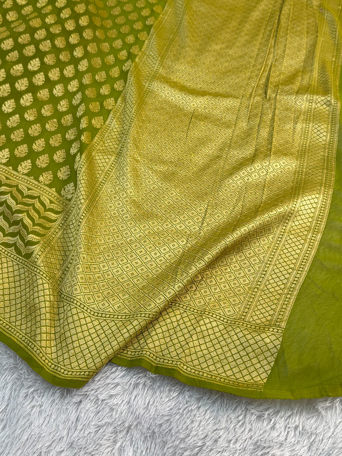Banarasi Pure Khaddi Chiffon Saree in Skirt Buti Design in Rusty Green Colour