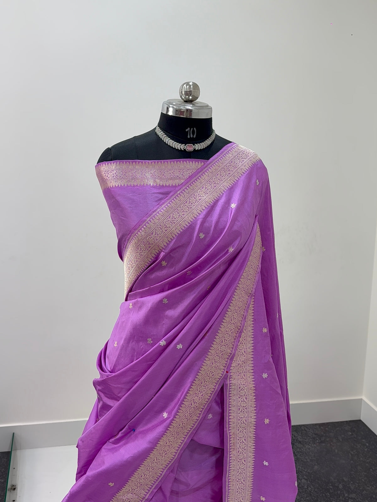 Handwoven pure katan silk saree with interlock weaving motifs and Konia design with intricate silver and gold zari in a light Purple colour