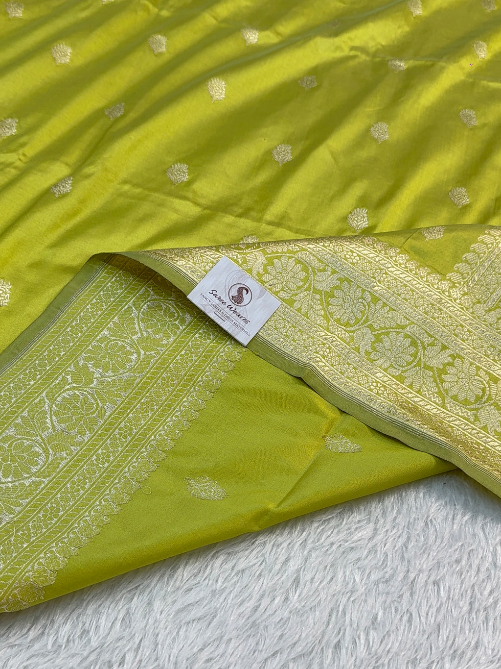Handwoven pure katan silk saree with interlock weaving motifs with intricate silver zari in Neon Pista colour