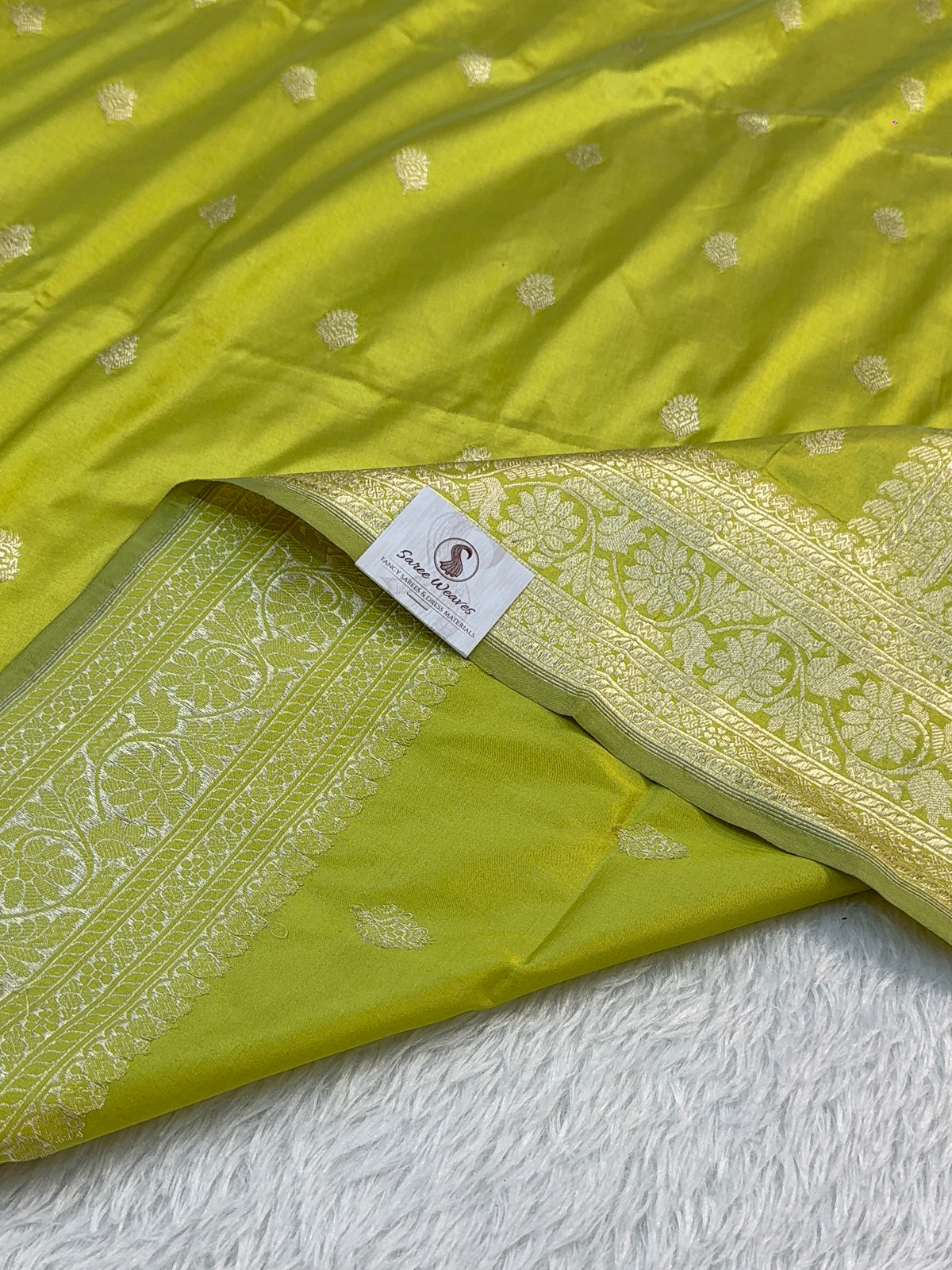 Handwoven pure katan silk saree with interlock weaving motifs with intricate silver zari in Neon Pista colour