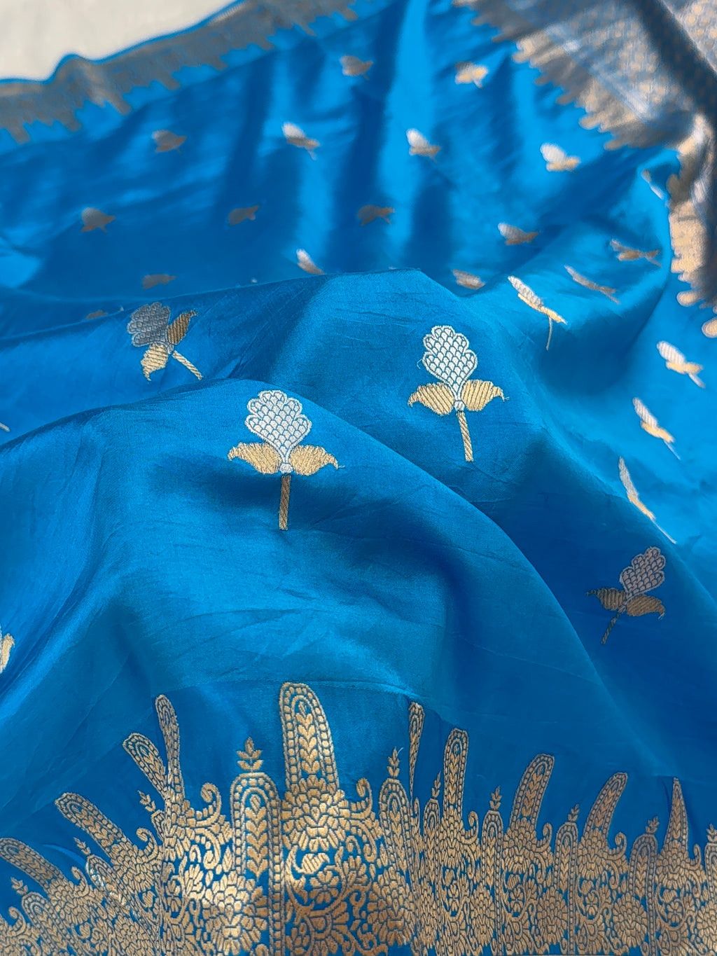 Banarasi Raw Mango Silk Saree in Border and Buta Design in Silver and Gold Zari work in Peacock Blue Color