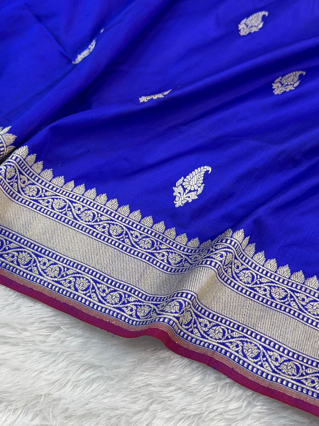 Handwoven pure katan silk saree with interlock weaving motifs in intricate silver and gold zari with Maroon Edge and Konia design in Royal Blue colour