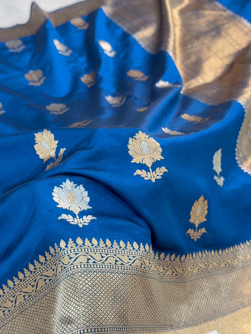 Banarasi Raw Mango Silk Saree in Border and Buta Design in Silver and Gold Zari work in German Blue Color