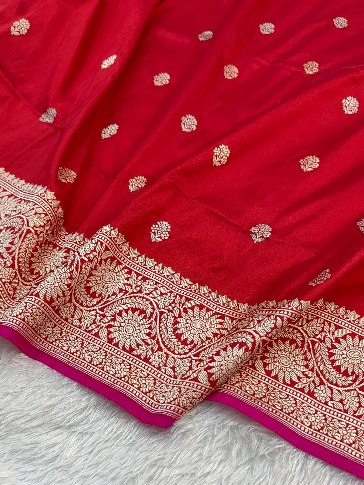 Handwoven pure katan silk saree in Red colour with interlock weaving motifs with intricate silver and gold zari with Rani Colour Edge