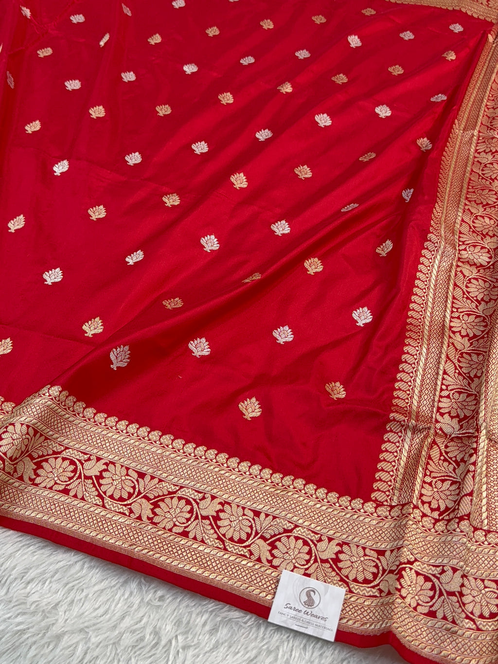 Handwoven pure katan silk saree with interlock weaving motifs with intricate silver and gold zari in red colour