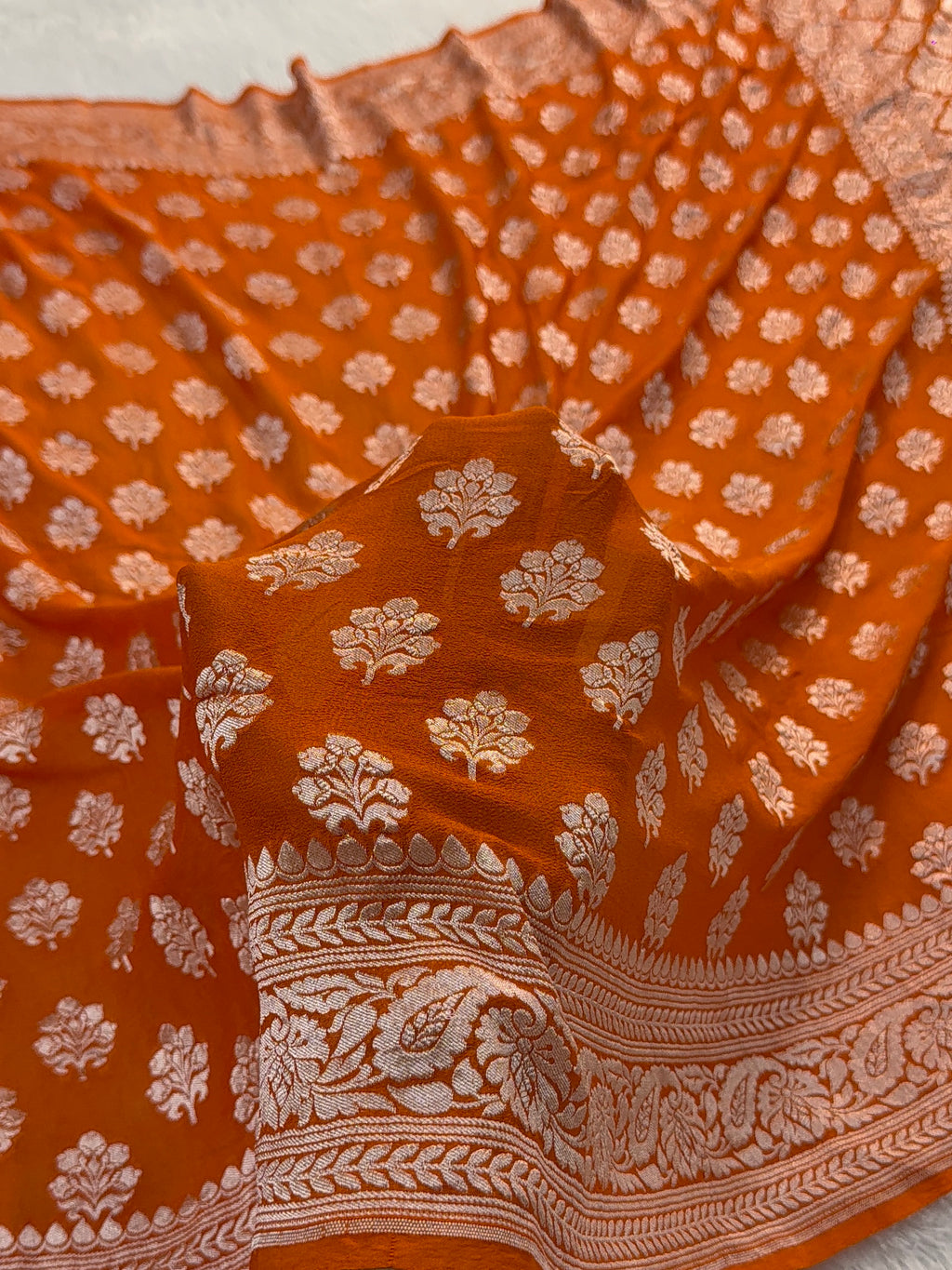Banarasi Pure Khaddi Chiffon Saree  with Light Gold Zari Work In Floral Motifs Design in Orange Colour