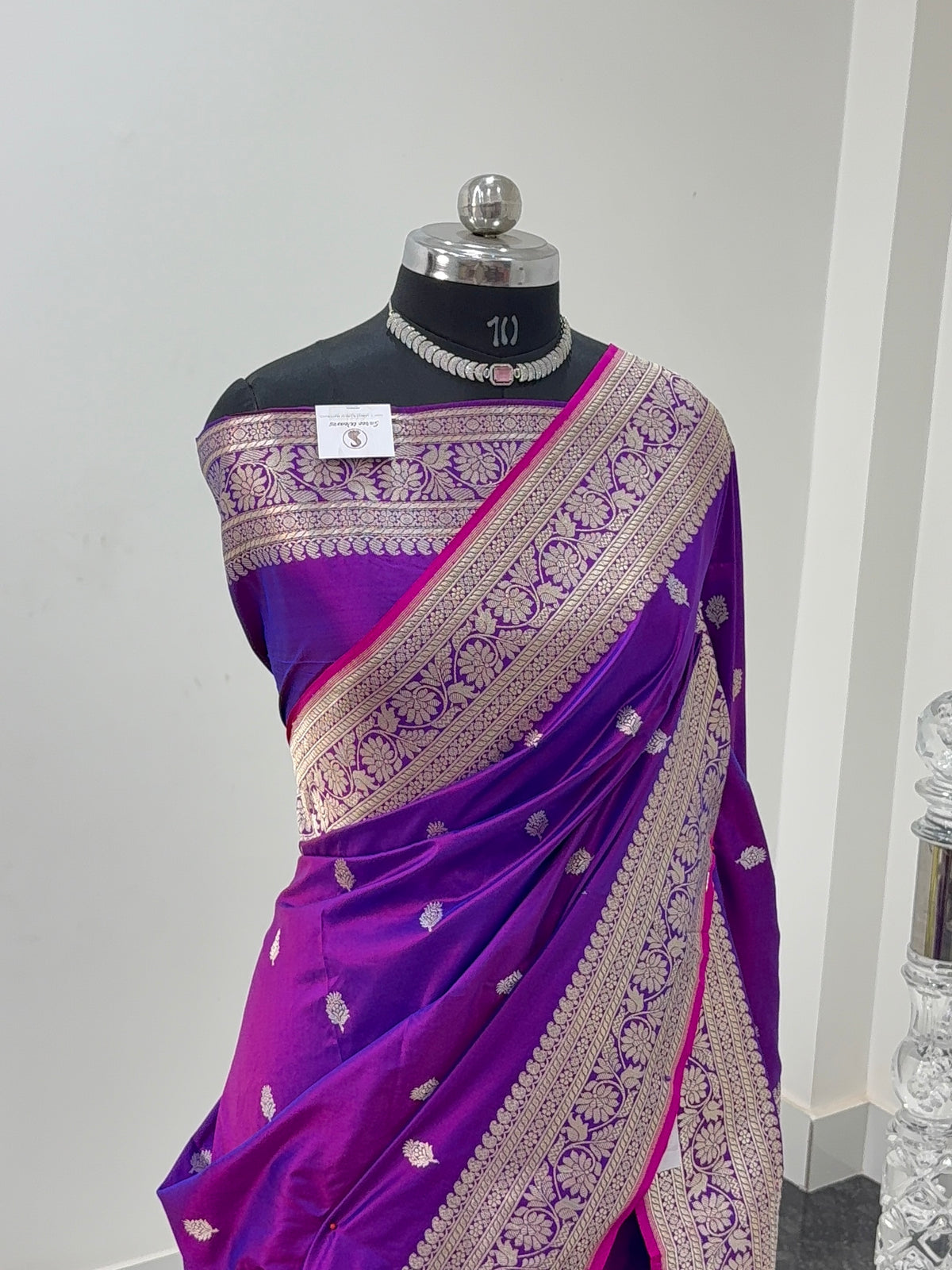 Handwoven pure katan silk saree with interlock weaving motifs in intricate silver and gold zari with Rani Edge in Deep Violet colour