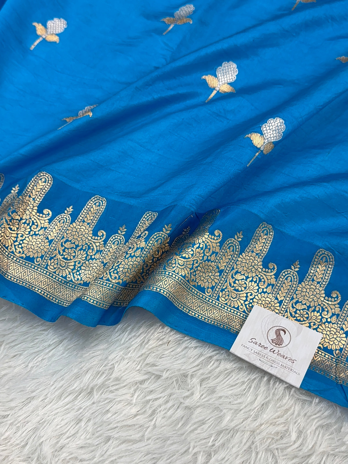 Banarasi Raw Mango Silk Saree in Border and Buta Design in Silver and Gold Zari work in Peacock Blue Color