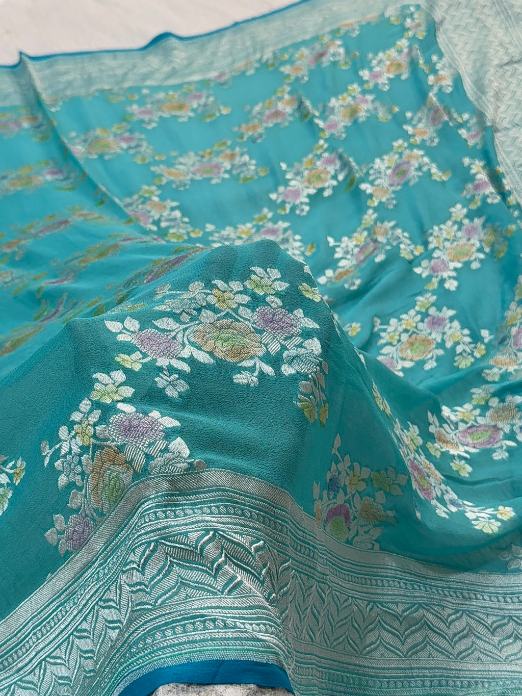 Banarasi Pure Khaddi Chiffon Saree  with Silver Zari Work In Floral Jaal Design with Meenakari by handbrush in Sea Green Colour