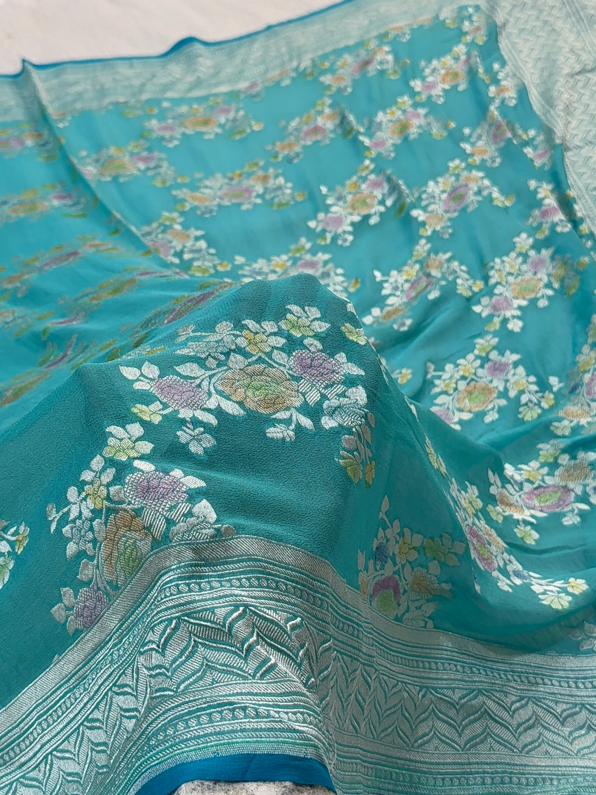 Banarasi Pure Khaddi Chiffon Saree  with Silver Zari Work In Floral Jaal Design with Meenakari by handbrush in Sea Green Colour
