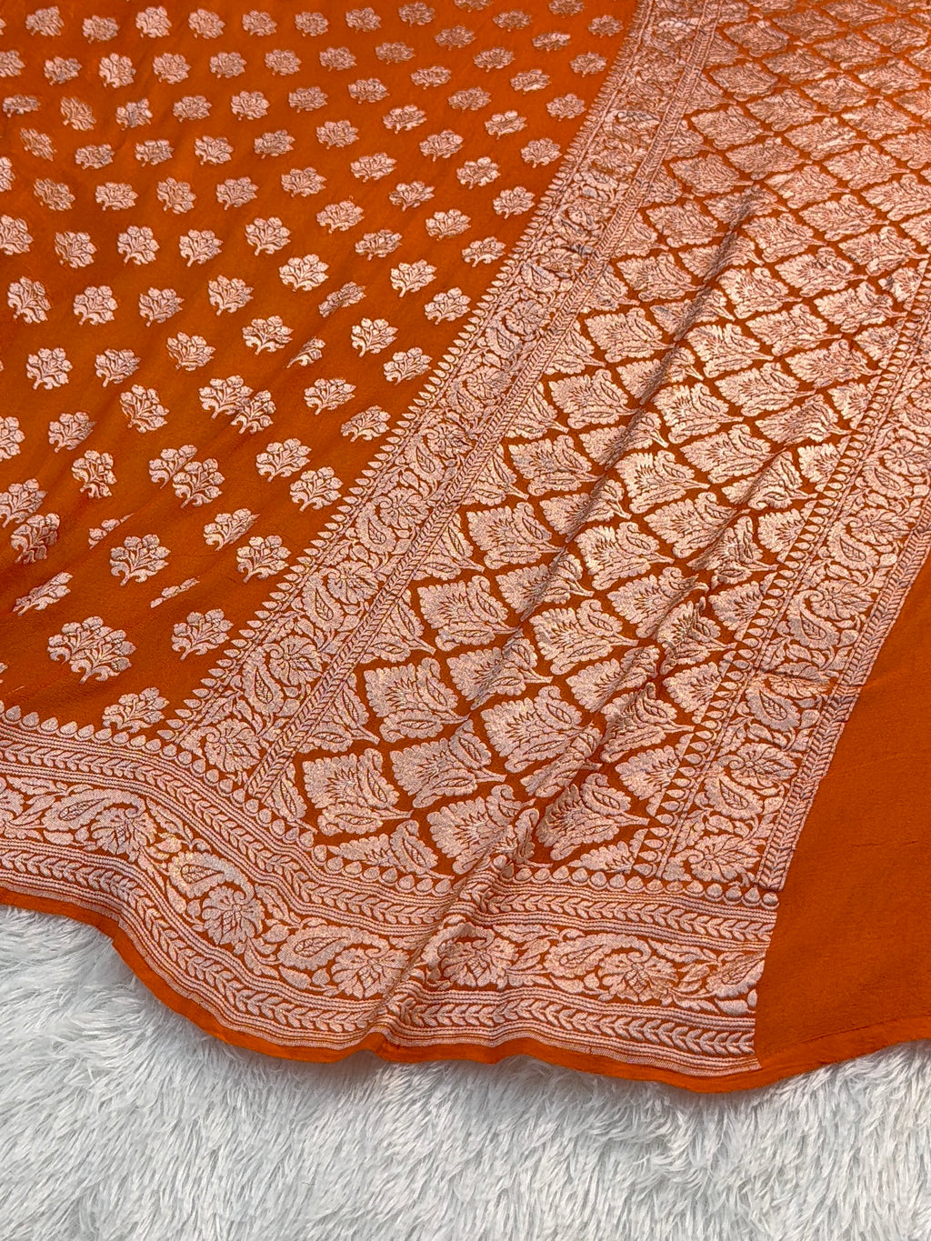 Banarasi Pure Khaddi Chiffon Saree  with Light Gold Zari Work In Floral Motifs Design in Orange Colour