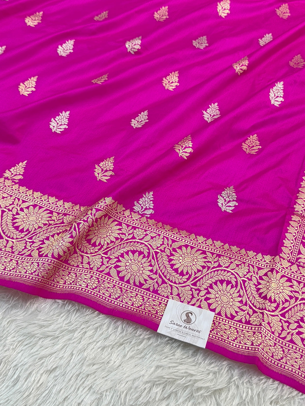 Handwoven pure katan silk saree with interlock weaving motifs with intricate silver and gold zari in a Rani Pink colour