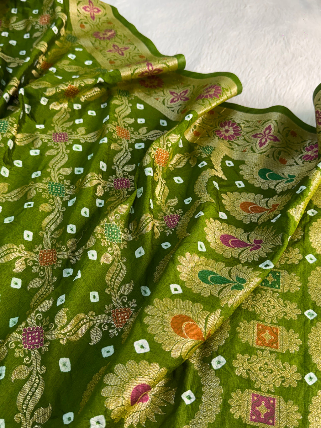 Banarasi Raw Silk Saree with Hand bandej all over in Jaal Design in Parrot Green Colour