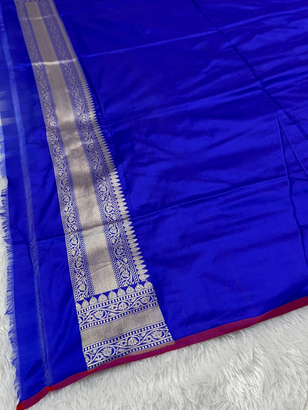 Handwoven pure katan silk saree with interlock weaving motifs in intricate silver and gold zari with Maroon Edge and Konia design in Royal Blue colour