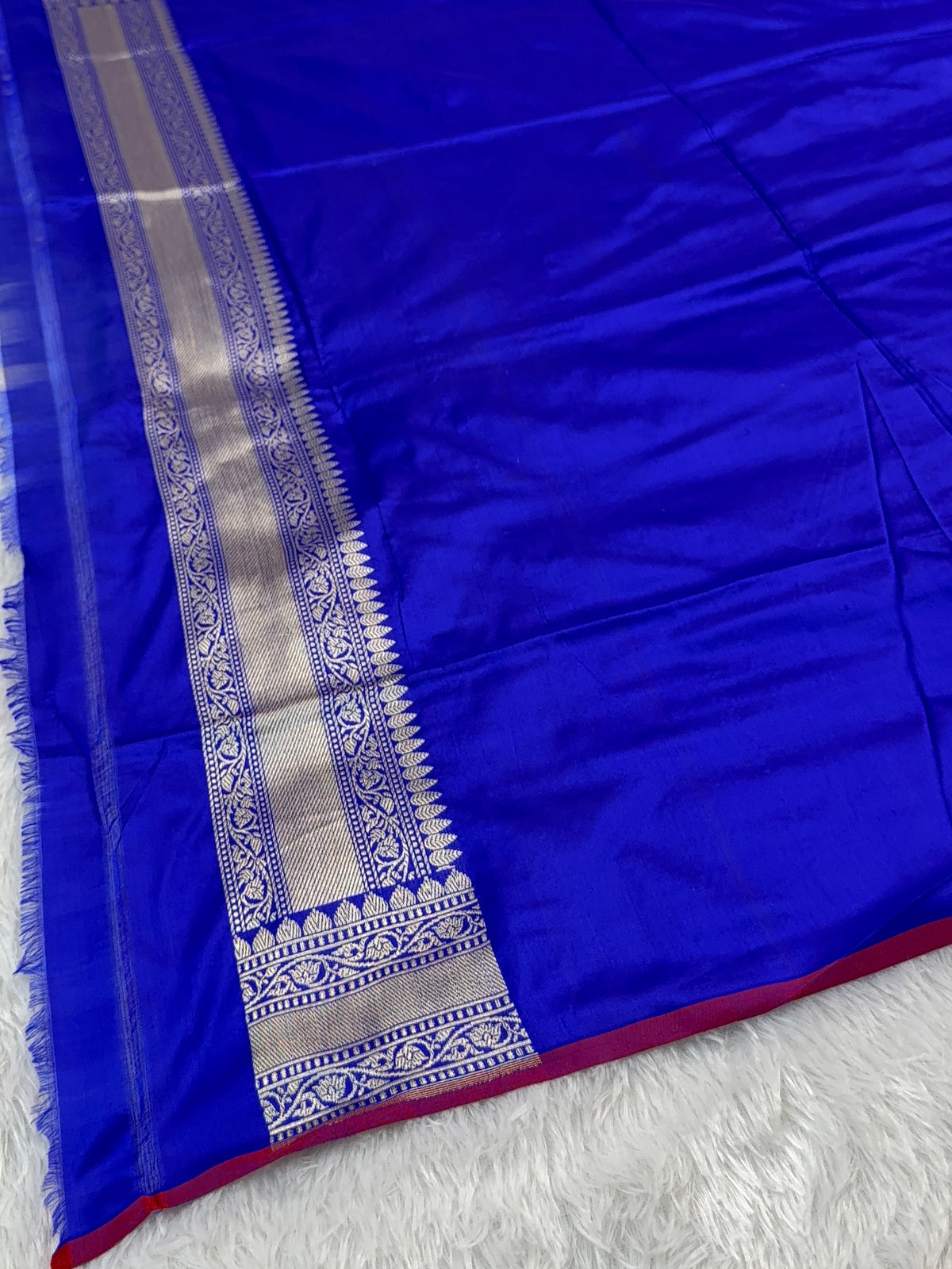 Handwoven pure katan silk saree with interlock weaving motifs in intricate silver and gold zari with Maroon Edge and Konia design in Royal Blue colour