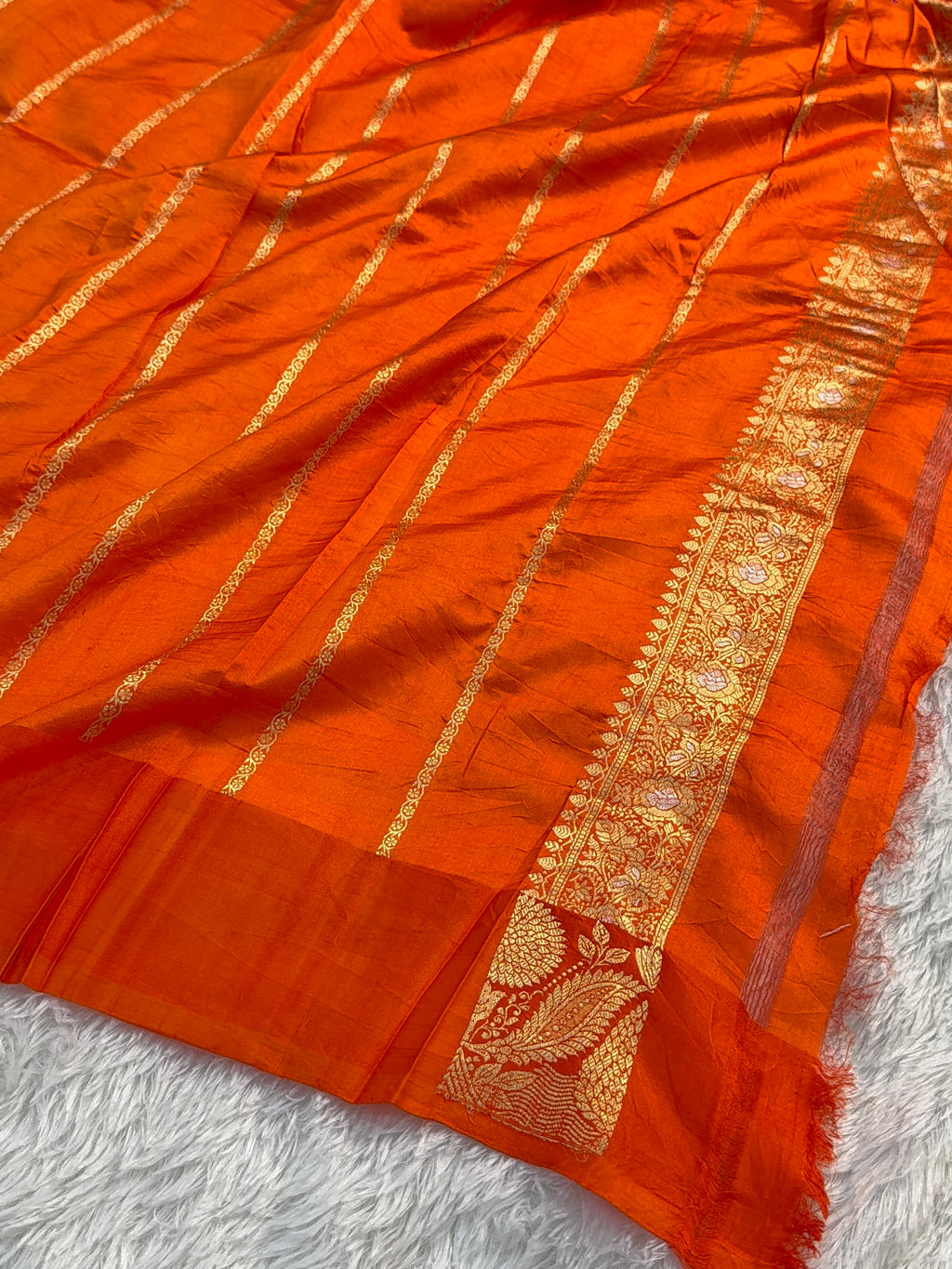 Banarasi Raw Mango Silk Saree in Border and Buti Design in Silver and Gold Zari work in a orange Color