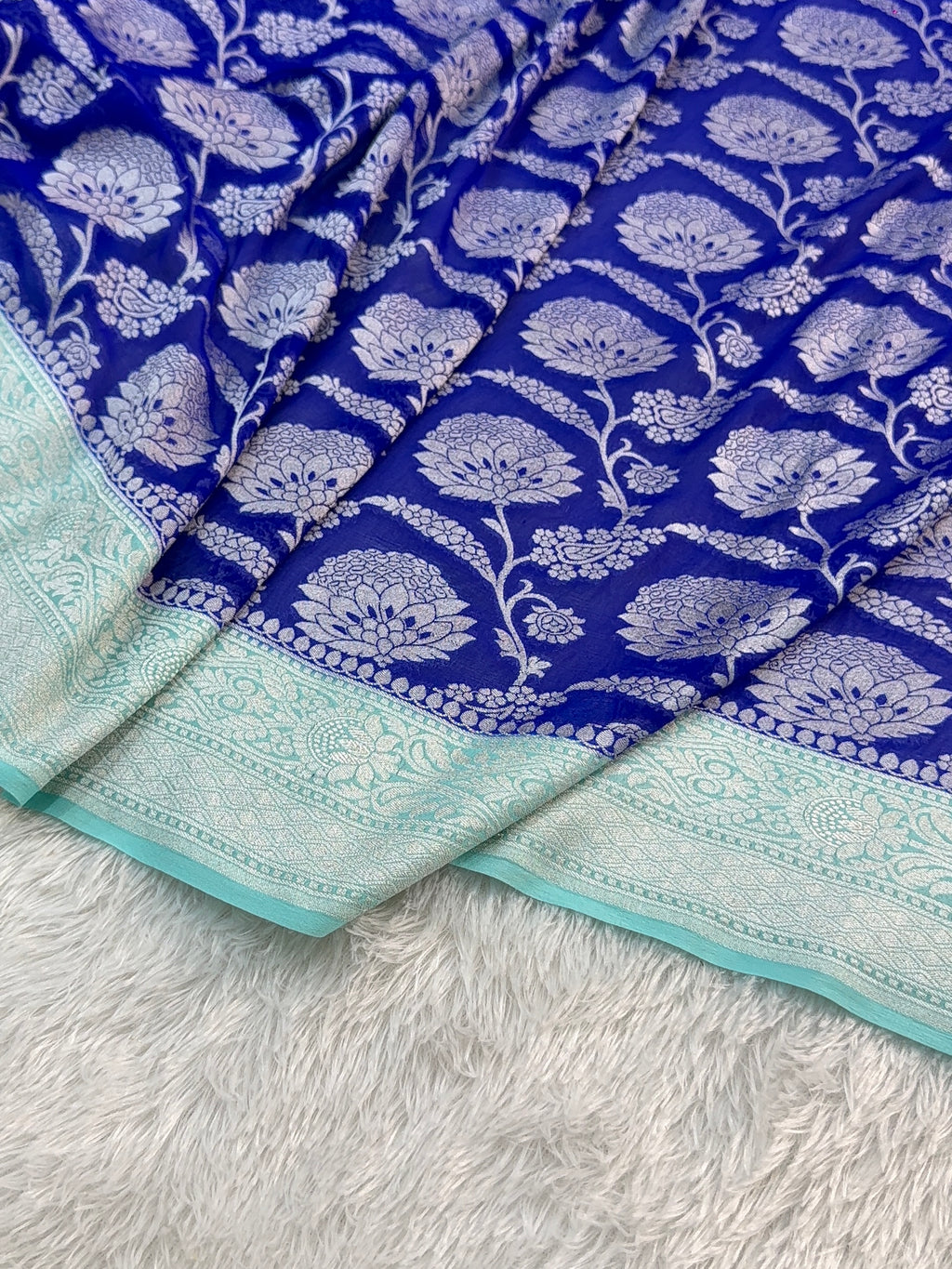 Banarasi Pure Khaddi Chiffon Saree  with Silver Zari Work In Floral Jaal Design in Royal Blue and Light Sea Green Colour Combination