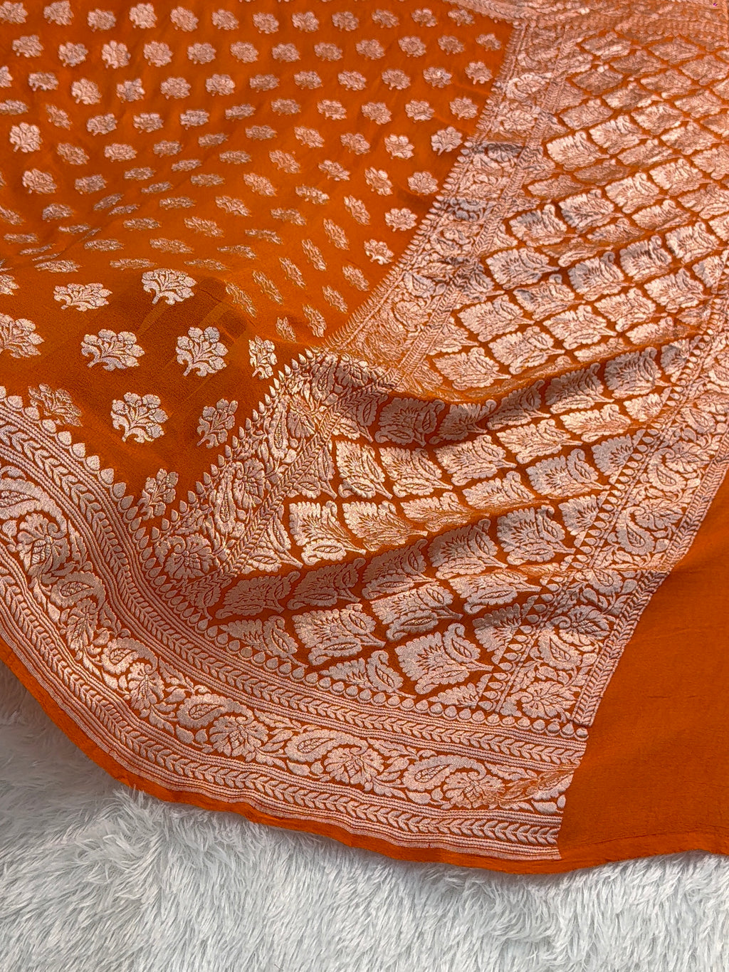 Banarasi Pure Khaddi Chiffon Saree  with Light Gold Zari Work In Floral Motifs Design in Orange Colour