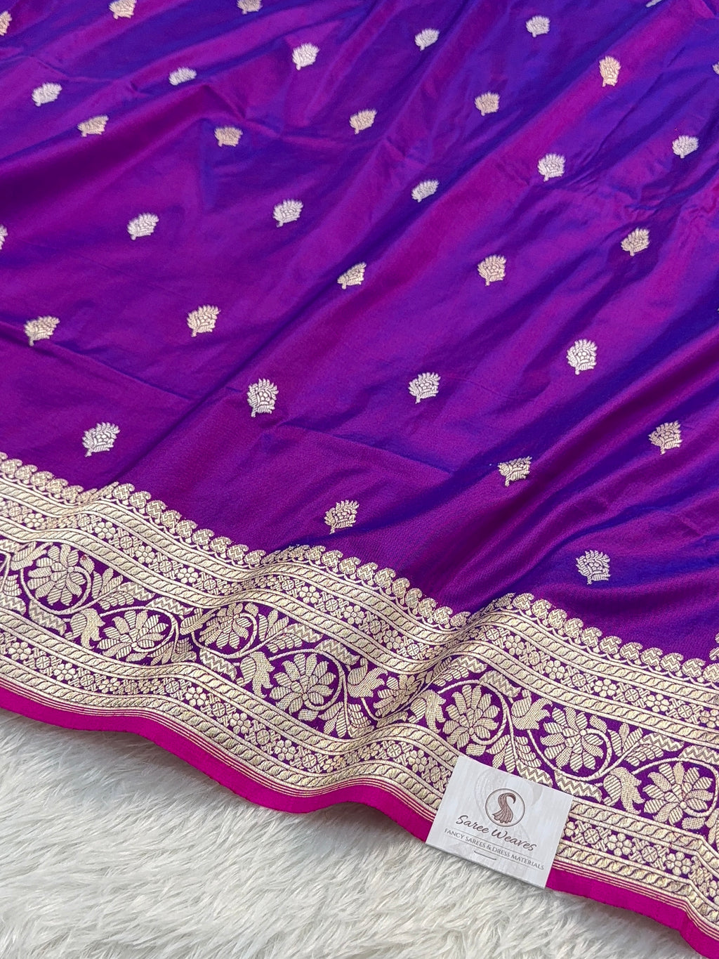 Handwoven pure katan silk saree with interlock weaving motifs in intricate silver and gold zari with Rani Edge in Deep Violet colour