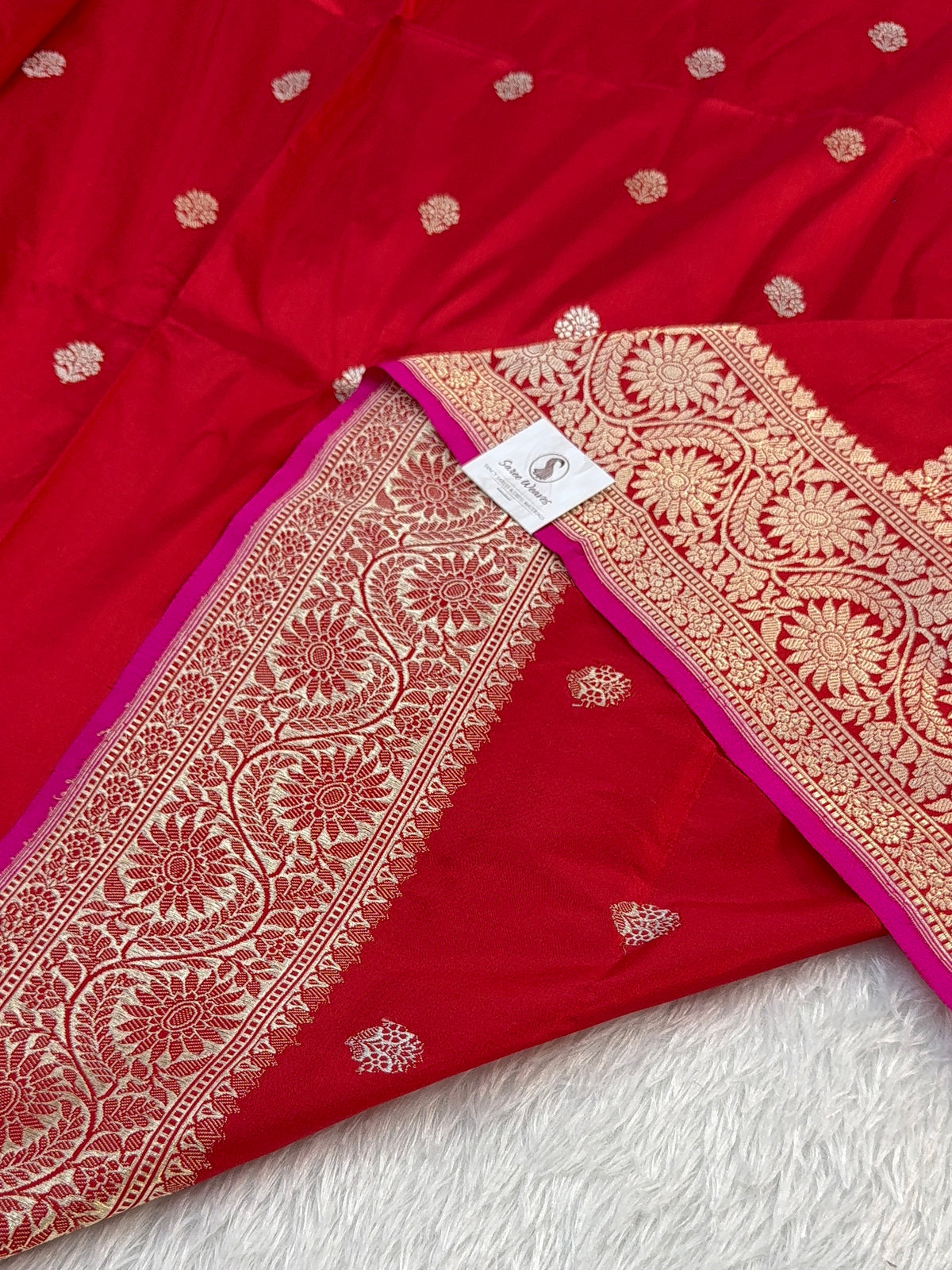 Handwoven pure katan silk saree in Red colour with interlock weaving motifs with intricate silver and gold zari with Rani Colour Edge