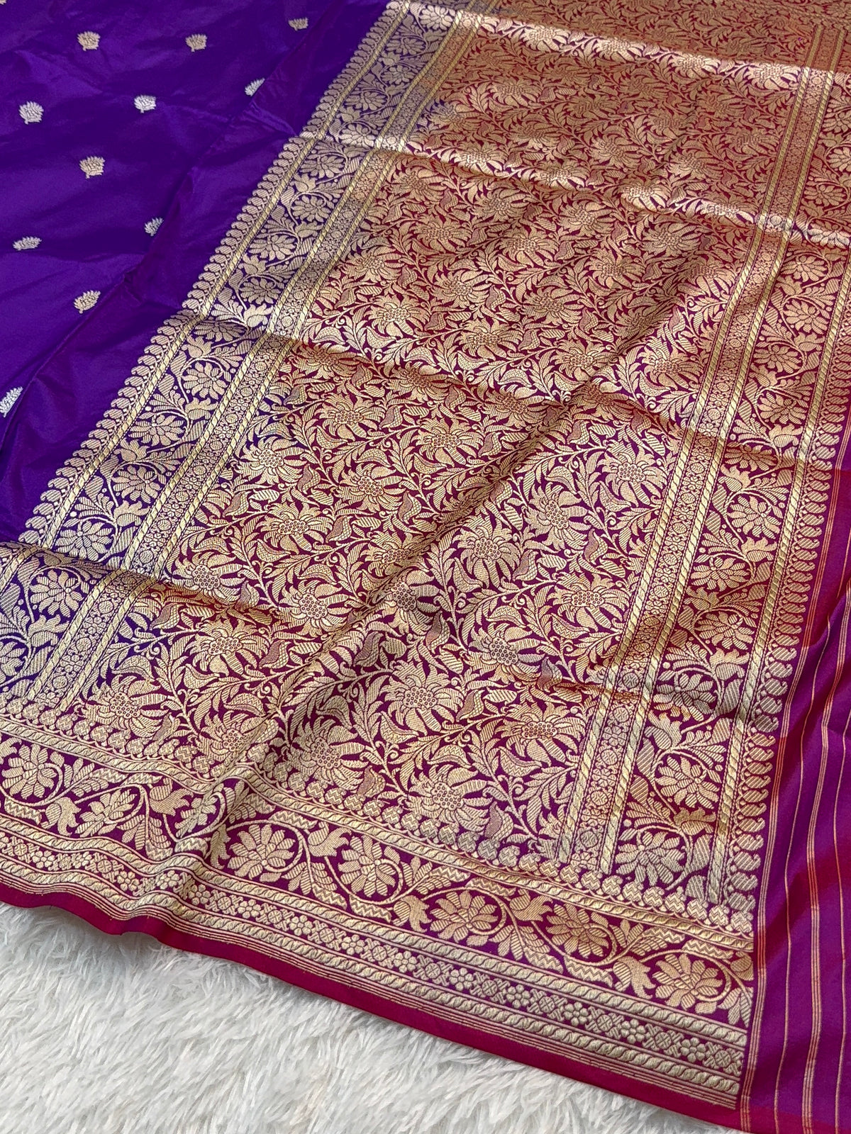 Handwoven pure katan silk saree with interlock weaving motifs in intricate silver and gold zari with Contrast of Deep Violet and Shot Rani Colour