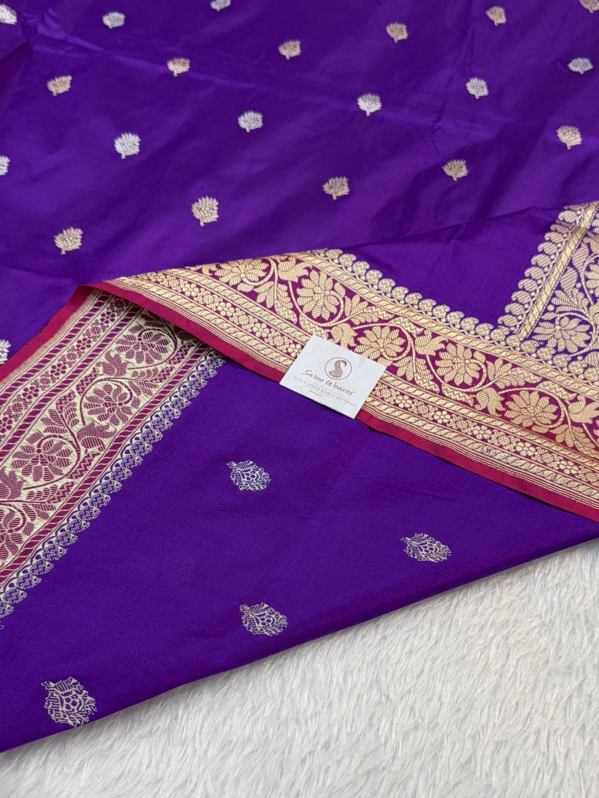 Handwoven pure katan silk saree with interlock weaving motifs in intricate silver and gold zari with Contrast of Deep Violet and Shot Rani Colour