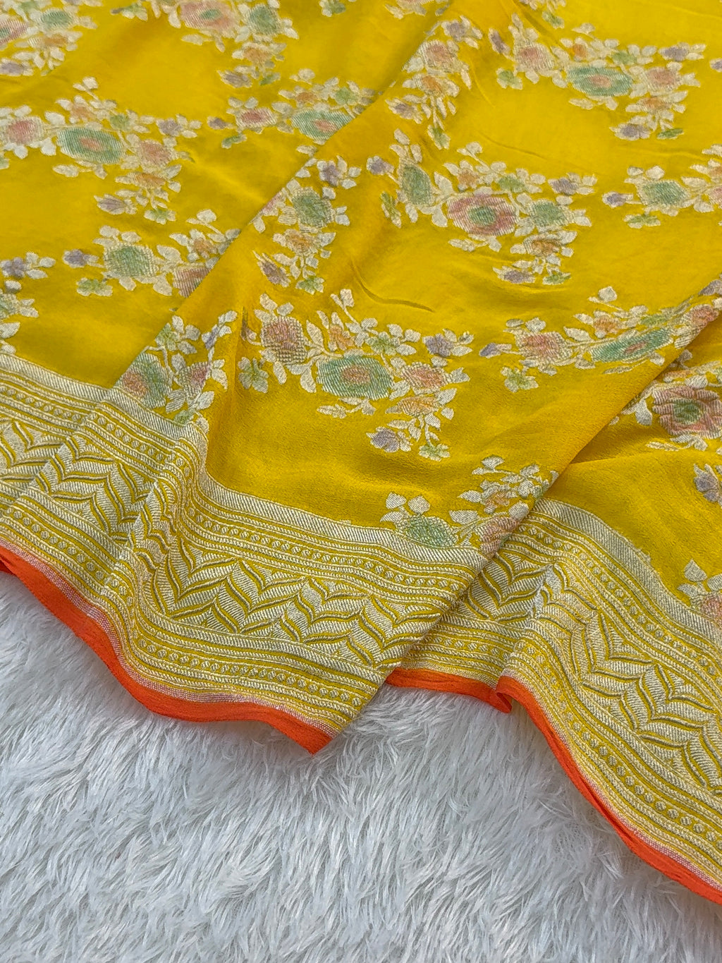 Banarasi Pure Khaddi Chiffon Saree  with Silver Zari Work In Floral Jaal Design with Meenakari by handbrush Yellow Colour with orange edge