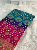 Banarasi Raw Silk Saree with Hand bandej all over in Motifs Design in Rani and Bottle Green Colour