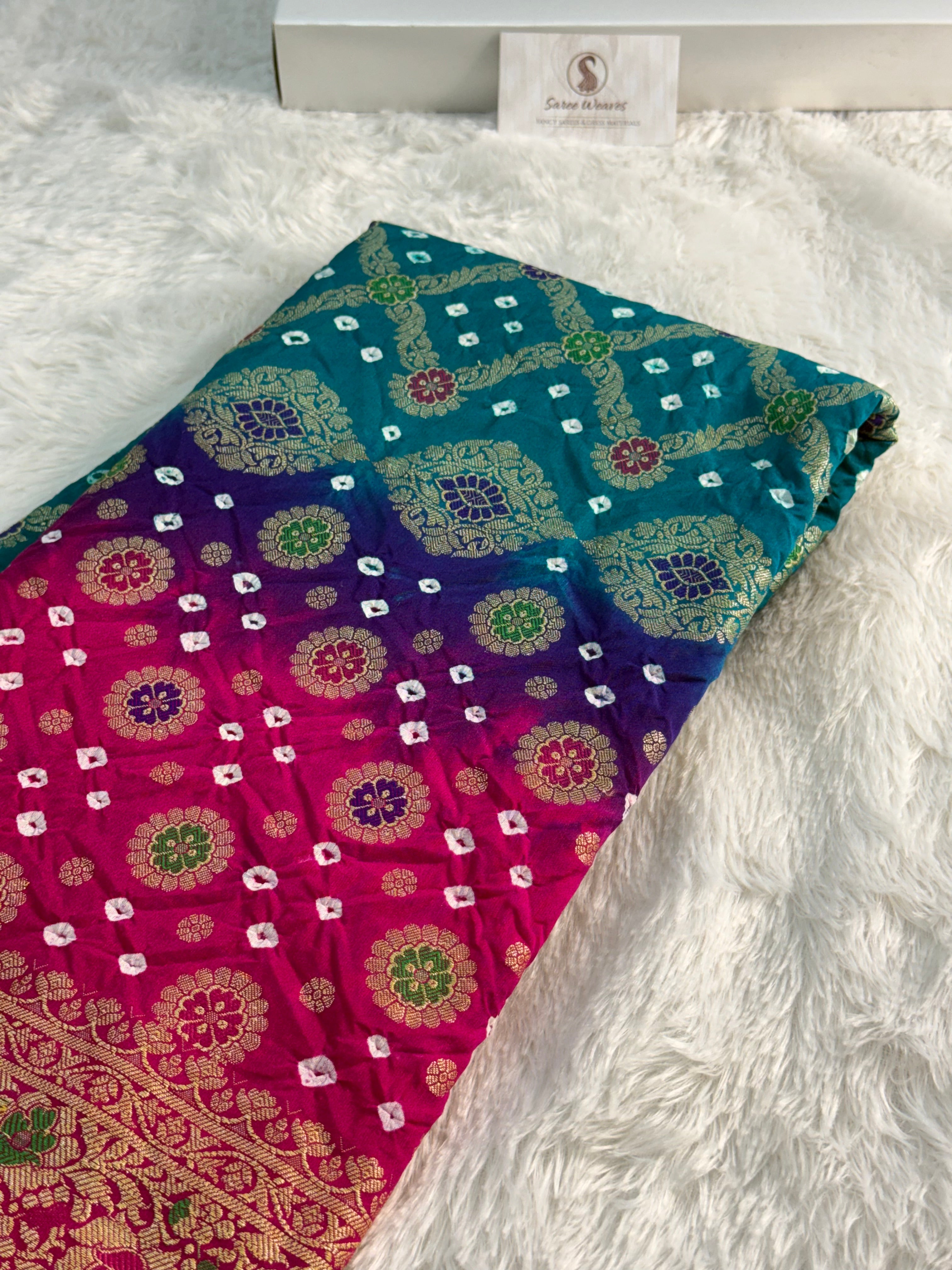 Banarasi Raw Silk Saree with Hand bandej all over in Motifs Design in Rani and Bottle Green Colour