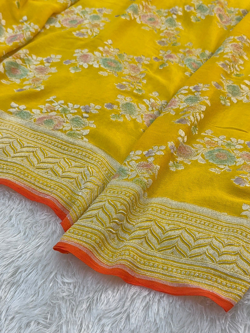 Banarasi Pure Khaddi Chiffon Saree  with Silver Zari Work In Floral Jaal Design with Meenakari by handbrush Yellow Colour with orange edge