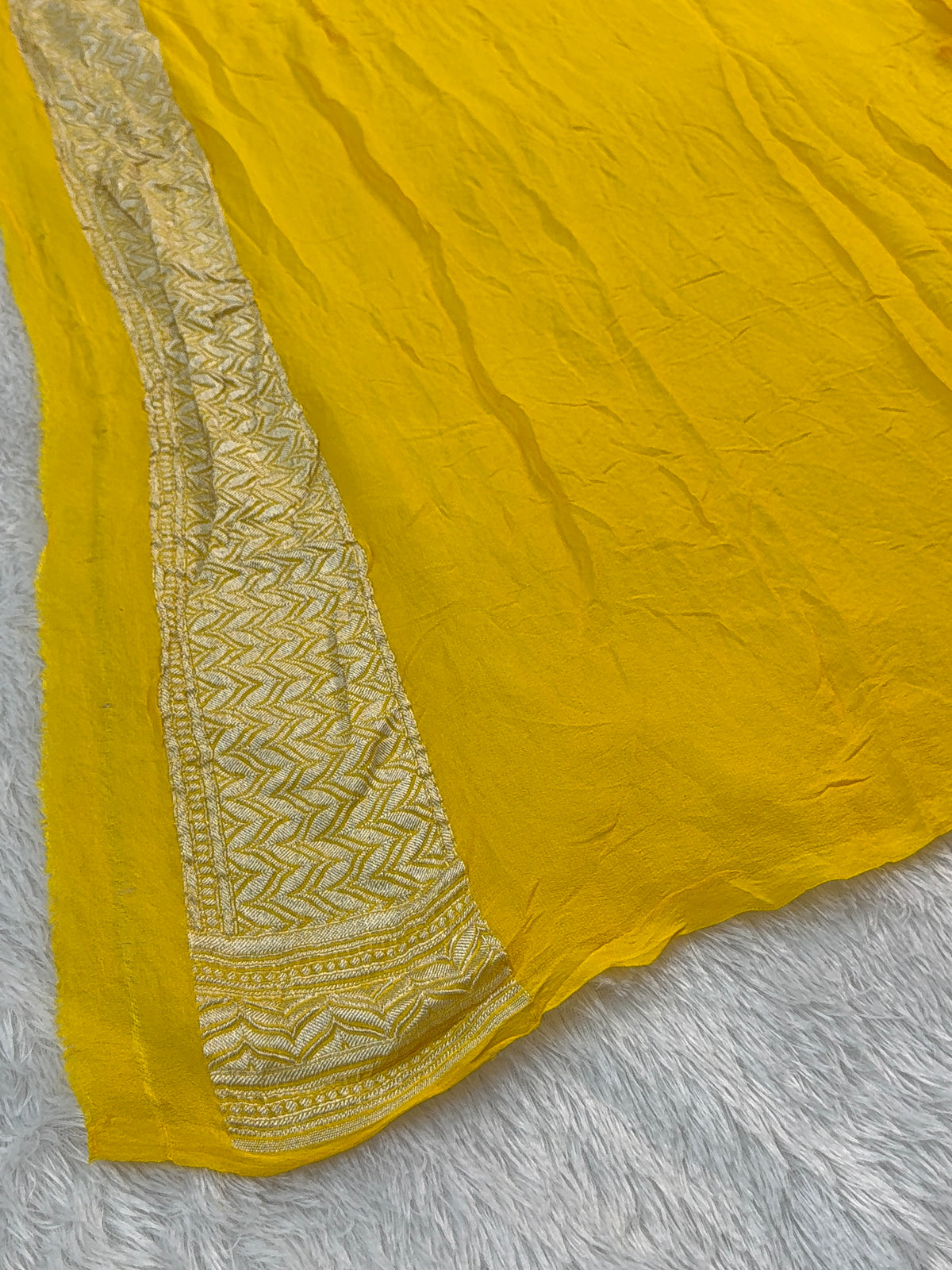 Banarasi Pure Khaddi Chiffon Saree  with Silver Zari Work In Floral Jaal Design with Meenakari by handbrush Yellow Colour with orange edge