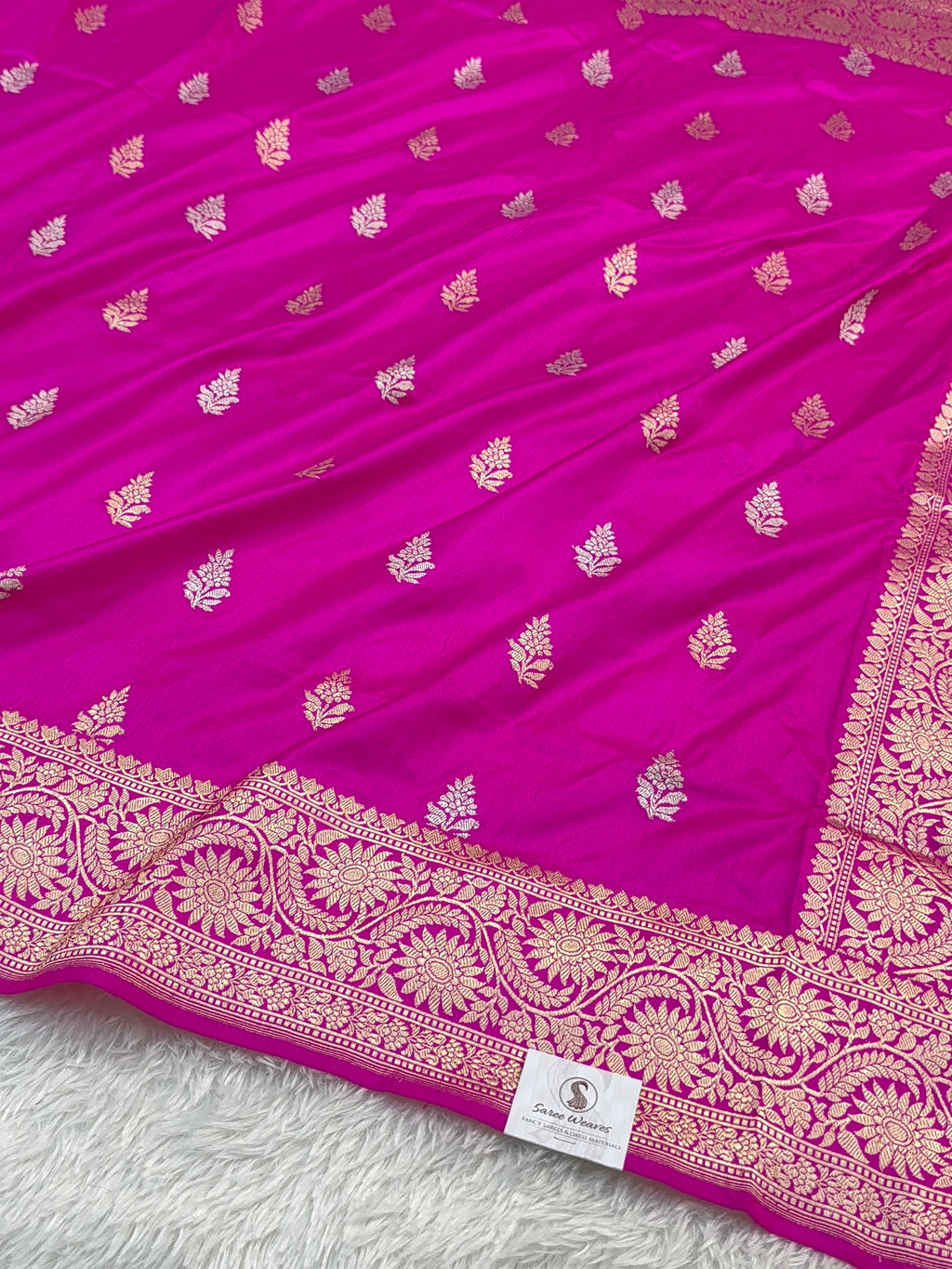 Handwoven pure katan silk saree with interlock weaving motifs with intricate silver and gold zari in a Rani Pink colour