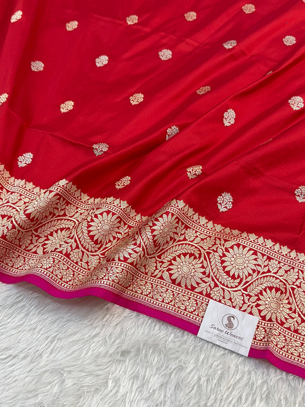 Handwoven pure katan silk saree in Red colour with interlock weaving motifs with intricate silver and gold zari with Rani Colour Edge