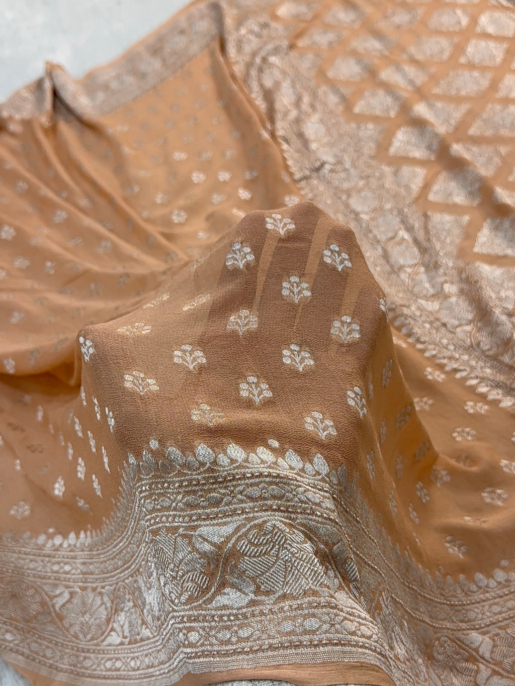 Banarasi Pure Khaddi Chiffon Saree  with Silver Zari Work with Small Motifs Pattern Design in Peach Colour
