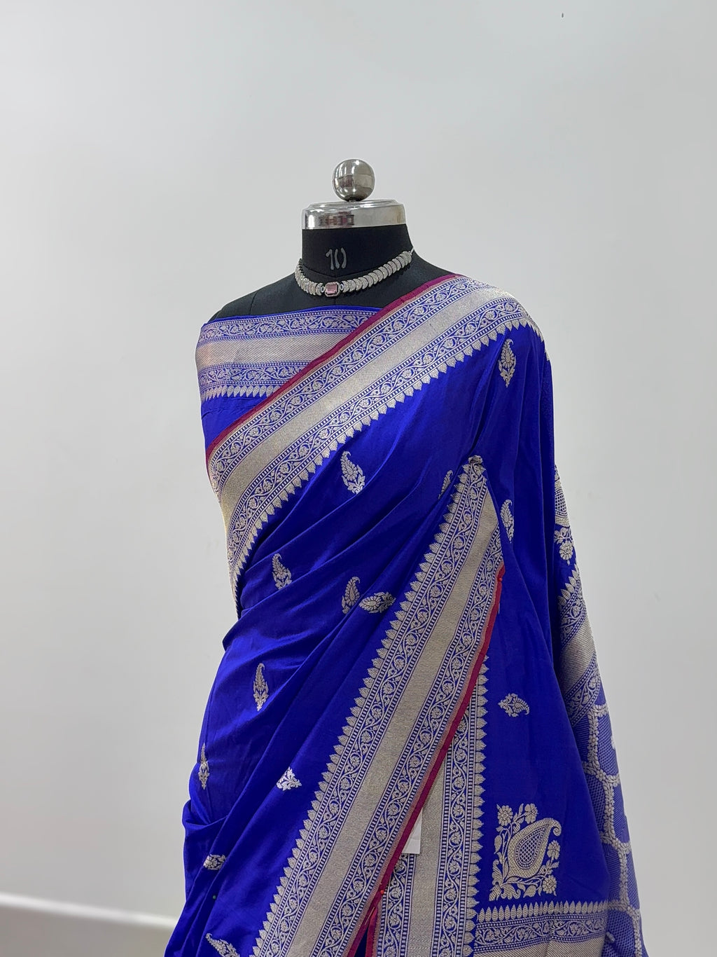 Handwoven pure katan silk saree with interlock weaving motifs in intricate silver and gold zari with Maroon Edge and Konia design in Royal Blue colour