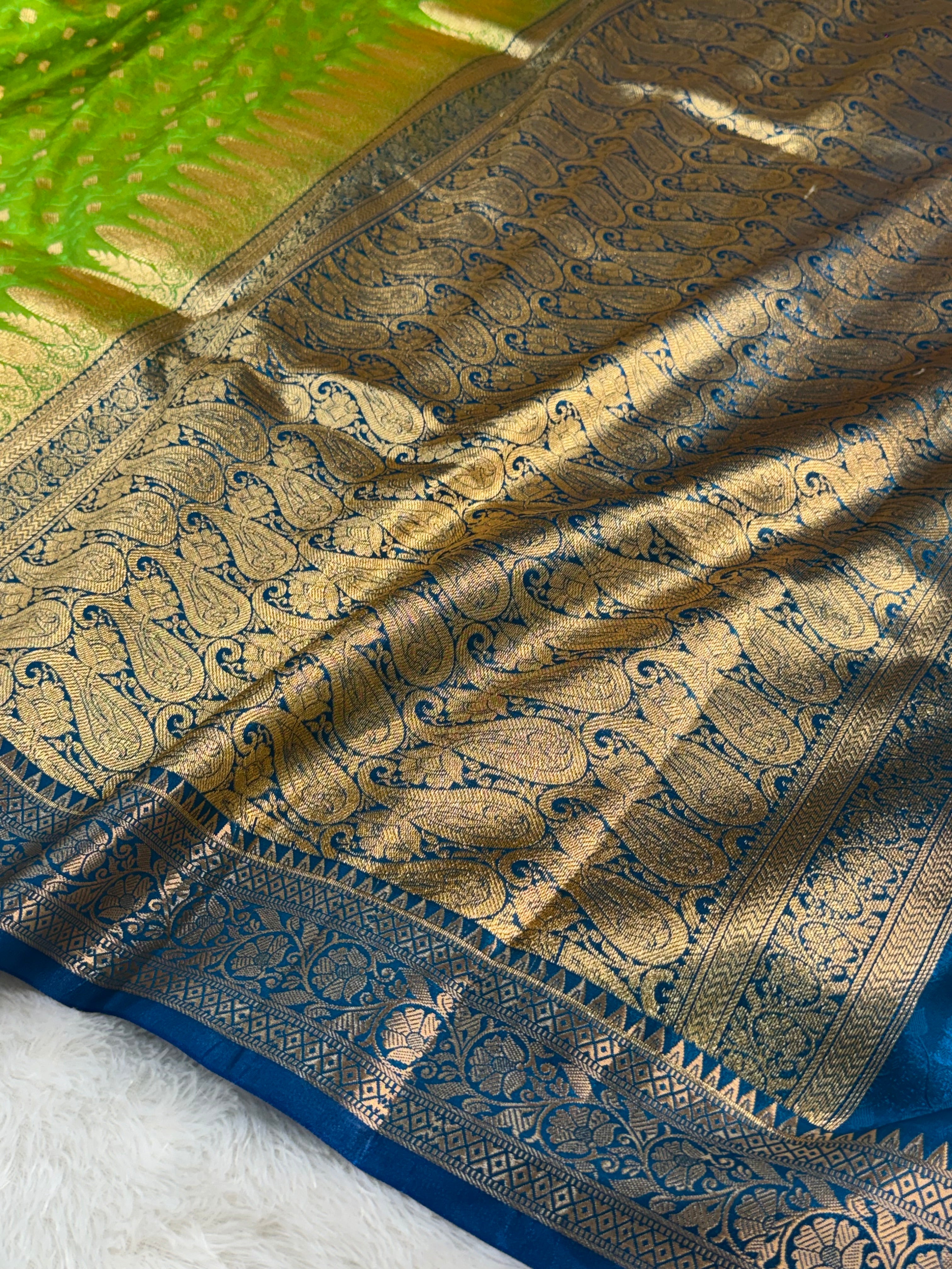 Banarasi satin silk saree in contrast Parrot green color with tanchoi design all over the body