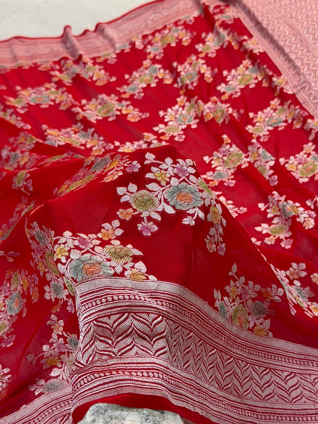 Banarasi Pure Khaddi Chiffon Saree  with Silver Zari Work In Floral Jaal Design with Meenakari by handbrush in Light Red Colour