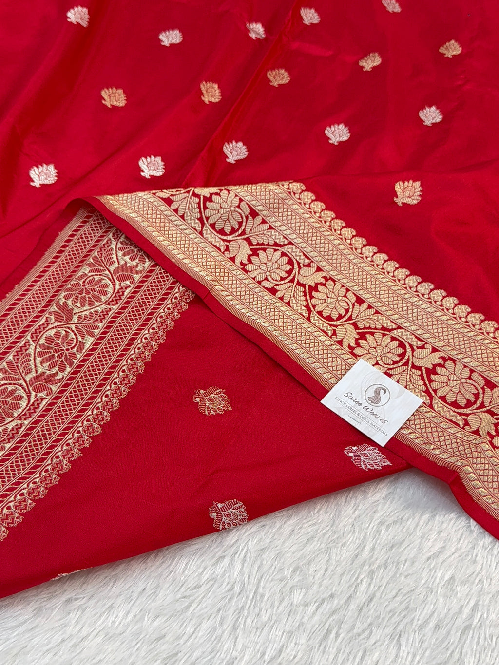 Handwoven pure katan silk saree with interlock weaving motifs with intricate silver and gold zari in red colour