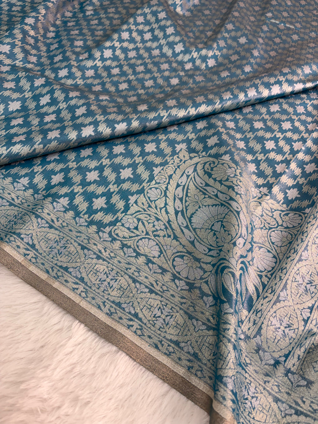 Banarasi tissue silk saree with Koniya design in navy blue color