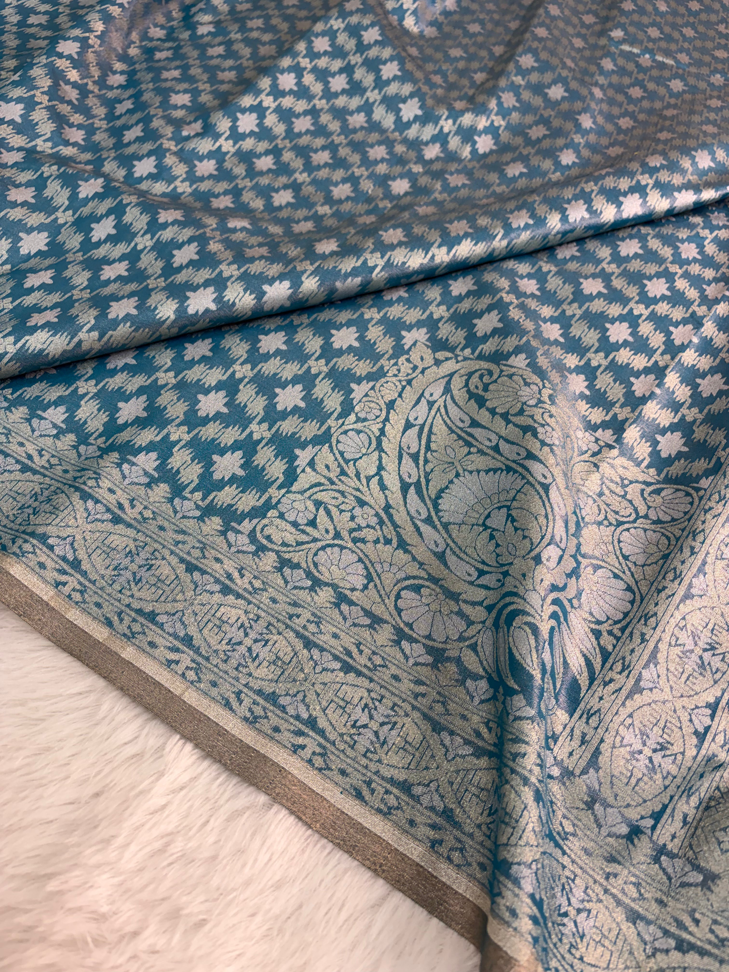 Banarasi tissue silk saree with Koniya design in navy blue color