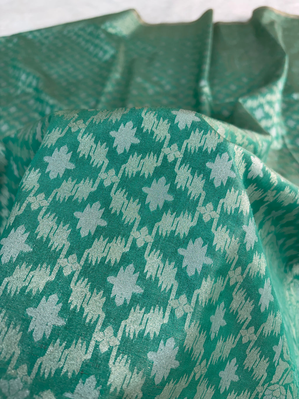 Banarasi tissue silk saree in bottle green color
