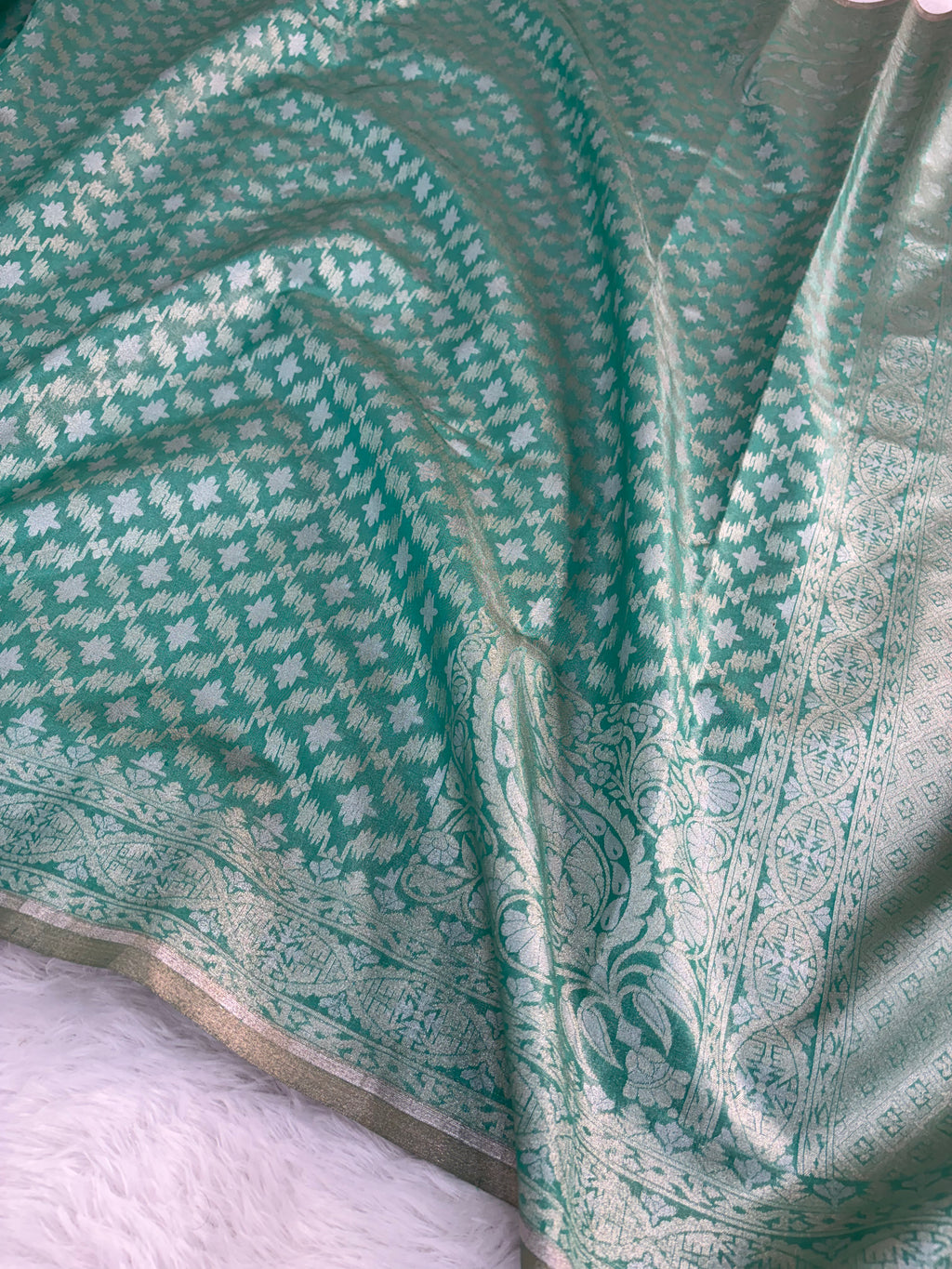 Banarasi tissue silk saree in bottle green color