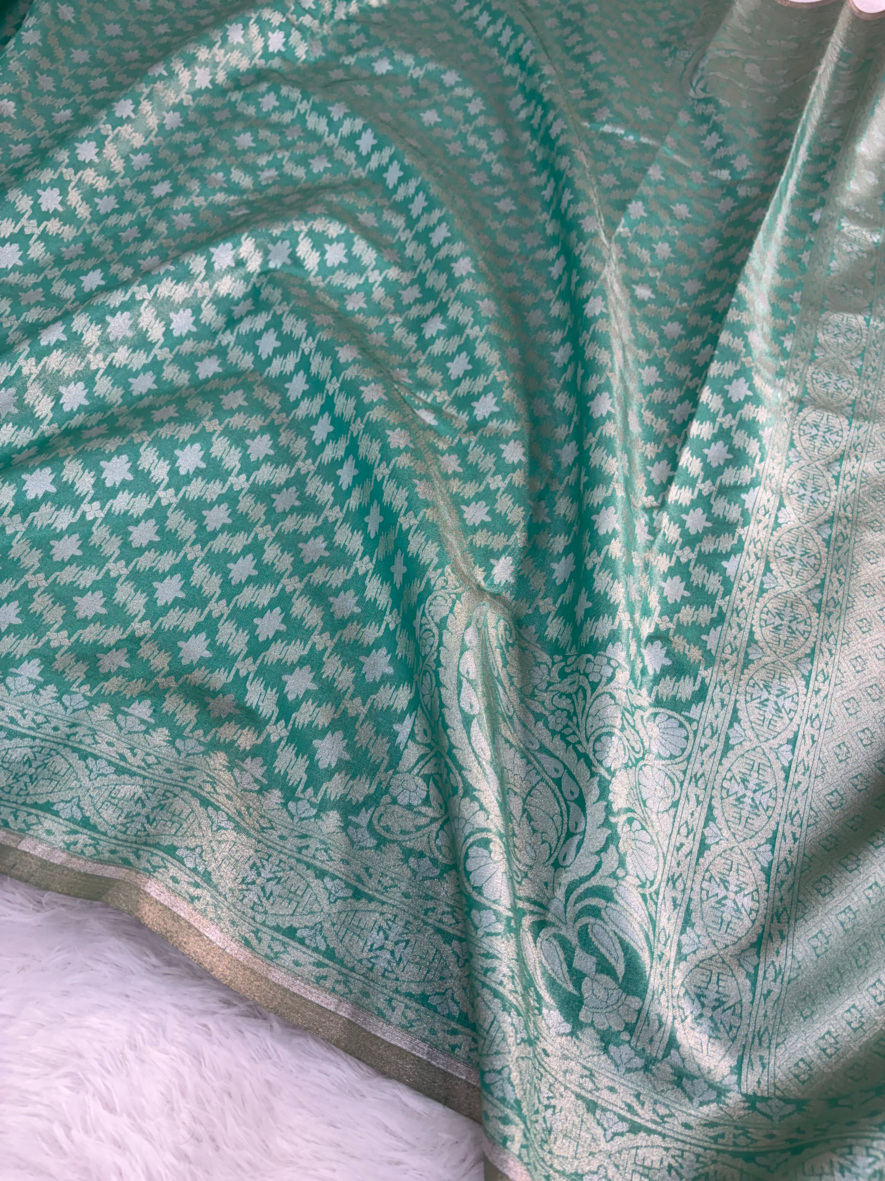 Banarasi tissue silk saree in bottle green color