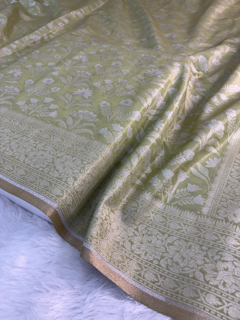 Banarasi tissue silk saree with floral buta design in Light Rusty Green color