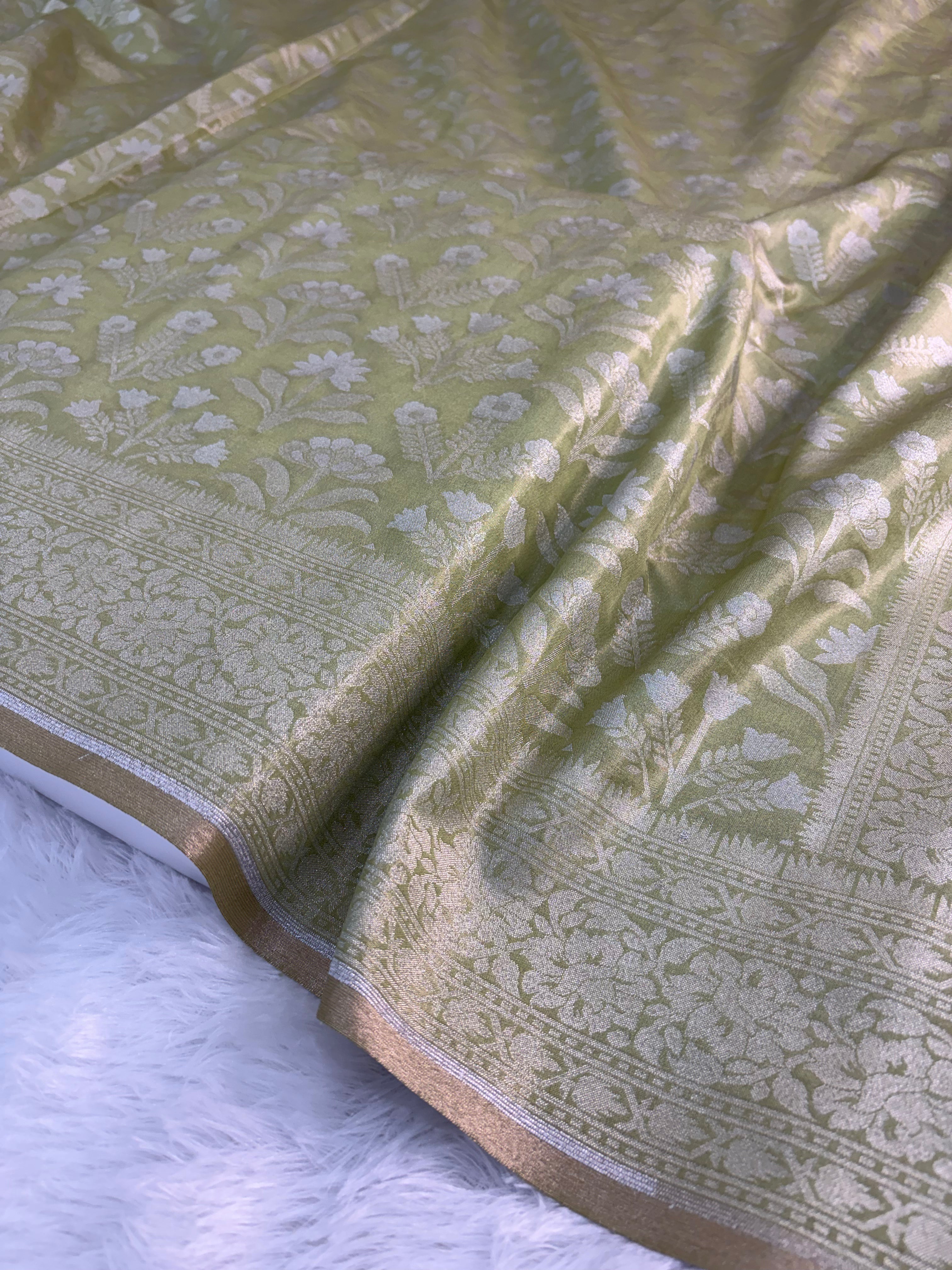 Banarasi tissue silk saree with floral buta design in Light Rusty Green color